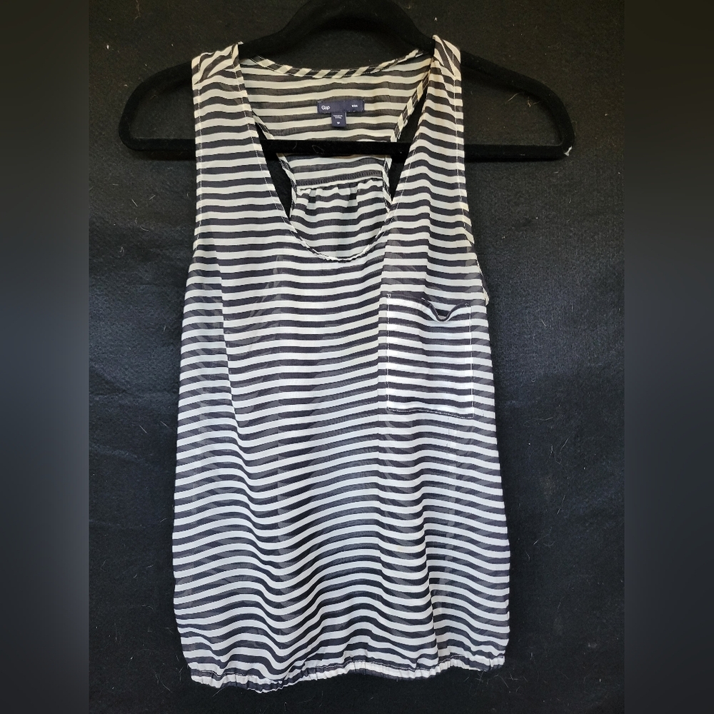 Medium sleeveless black and white striped sheer gap blouse.